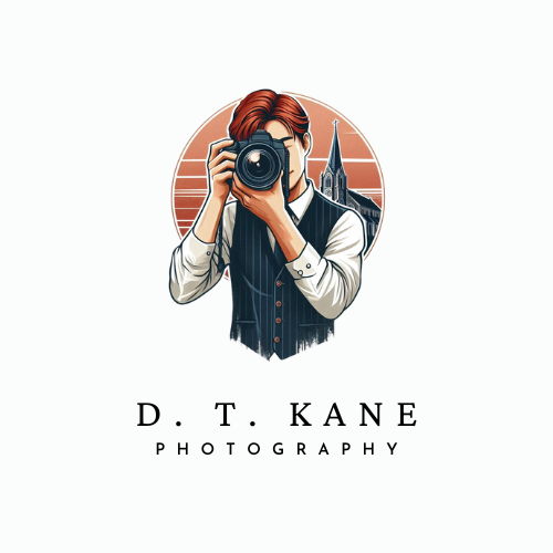 Logo showing a red-haired photographer holding camera to eye with church in the background